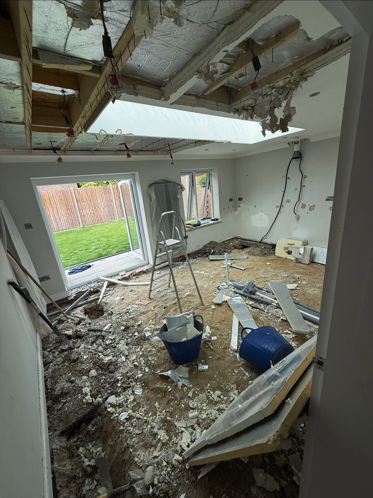 Room stripped back to structure with roof opening formed