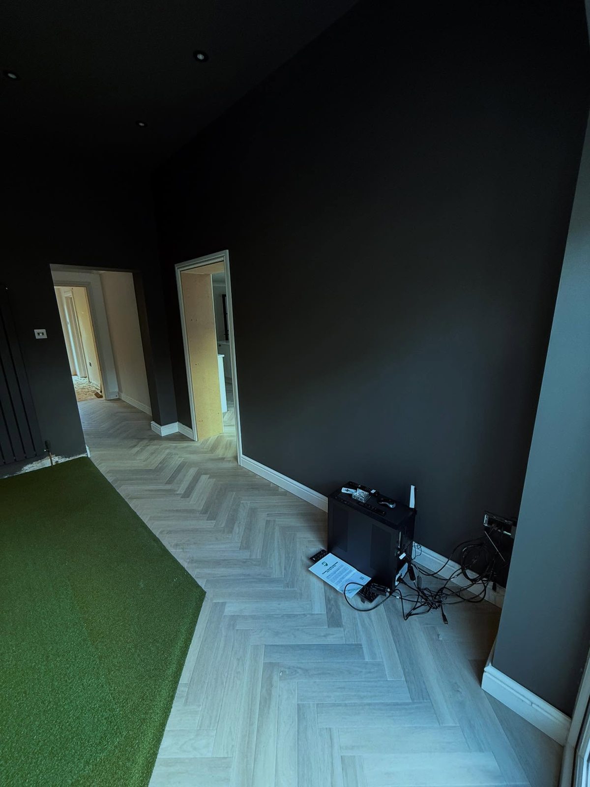 Golf sim room during fit-out with equipment being installed
